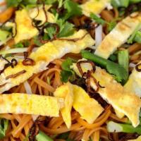 Kua Mee - Pad Lao · Stir fried rice noodles with homemade savory sauce topped with thinly sliced egg omelette an...