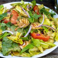Lao Salad · Gluten-Free. Fresh cripsy romaine lettuce, cucumbers, red onion, mint, tomato, and cilantro ...