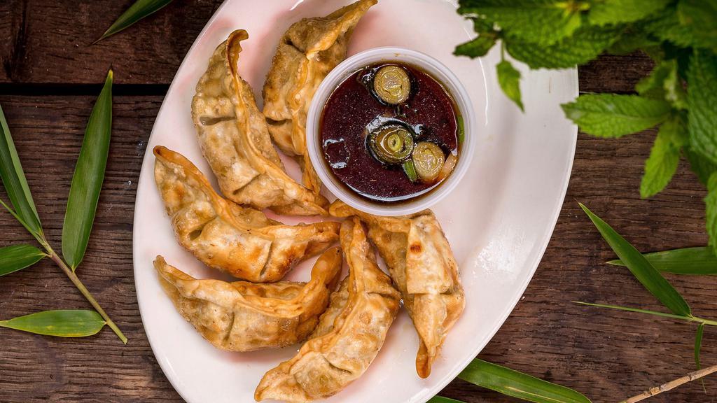 Potstickers · Deep-fried potstickers, served with homemade vinegar soy sauce.