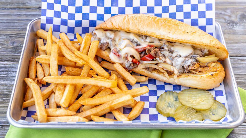 Philly Steak · Philly meat, mushrooms, onions, bell peppers, mayo with melted Swiss cheese on a grilled French roll bread.