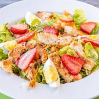 Ely'S Chicken Salad · Grilled chicken breast, fresh strawberries, hard boiled eggs, diced tomatoes, mixed cheese a...