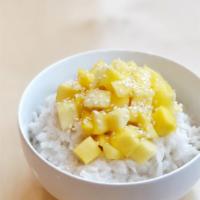 Mango Sweet Rice · Chunks of Mango, Jasmine rice and topped with sesame seeds. 
Our version of a Mango Sticky R...