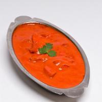 Butter Chicken · Boneless chicken barbecued and cooked in creamy tomato sauce.