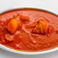 Chicken Vindaloo · Chicken cooked with potatoes in curry sauce with touch of vinegar.