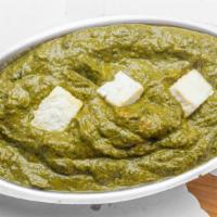 Saag Paneer · Indian cottage cheese cubes cooked in smooth and creamy spinach gravy.