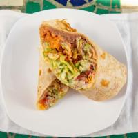 Veggie Burrito · Refried beans, rice, lettuce, guacamole, pico de gallo, cheese, and sour cream.