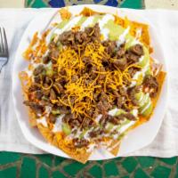 Super Nachos Platter · Corn tortilla chips topped with beans, cheese, guacamole, sour cream, pico de gallo, and car...