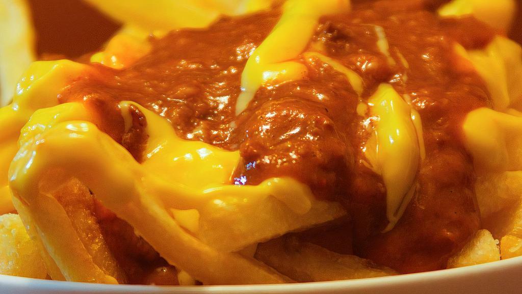 Chili Cheese Fries · French fries with cheese and chili.