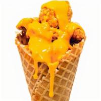 Chicken Waffle Cone · Waffle cone with your choice of different flavored chicken: cheesy, sweet chili, or maple ba...