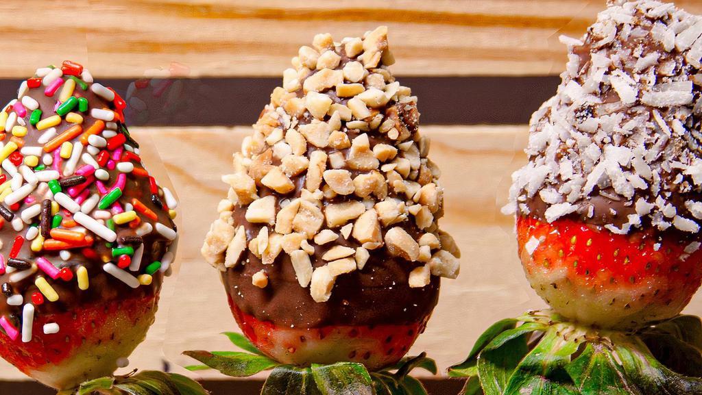 Strawberry Dipper · Strawberry dipped in chocolate and topping of your choice: plain, coconut, peanuts, or sprinkles.