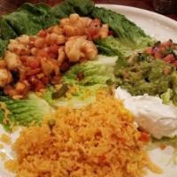 Tacos Al Carbon · Two fiat meat tacos cooked with pico de gallo. Served with rice, beans, pico de gallo and gu...