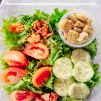 Garden Salad · Fresh greens, tomatoes, cucumbers, carrots, croutons and dressing.