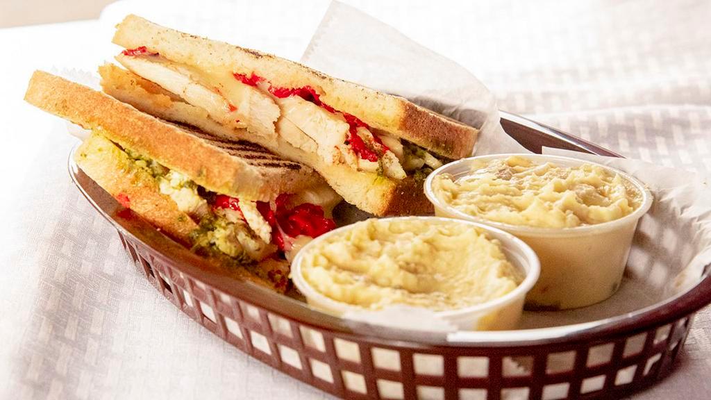 Grilled Chicken Pesto Panini · Grilled chicken, melted Mozzarella, roasted peppers and pesto.