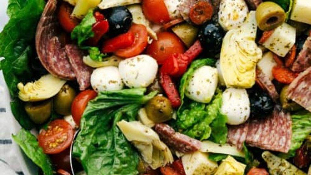 House Salad · Organic greens, roma tomatoes, cucumbers, shaved carrots, balsamic vinaigrette