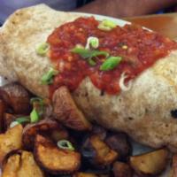 Burrito · Tofu, potatoes, black bean chili, sour cream and salsa in a wheat tortilla.