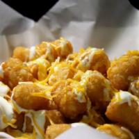 Loaded Tots · tater tots topped with sour cream & cheese