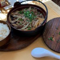 Sukiyaki · Sweet soy sauce, thin sliced fatty beef, tofu, vegetables, shirataki noodles.
