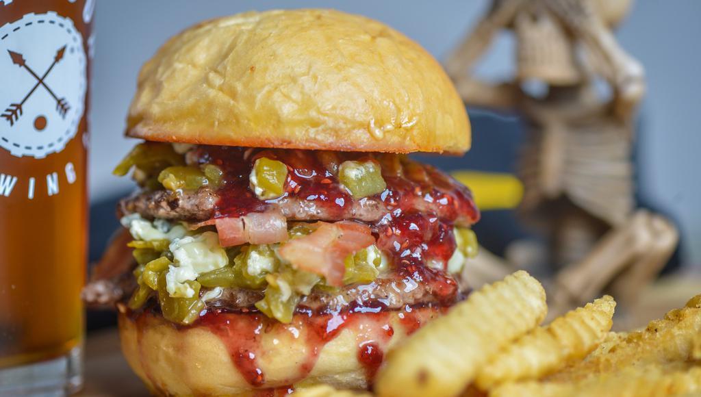 Thunderkush Burger · Fire roasted green chilies, smoked blue cheese, bacon, raspberry preserves.