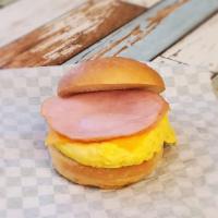 Egg, Ham & Cheese Sandwich · Homemade French roll bread with garlic butter, egg, ham and cheddar cheese, along with a has...