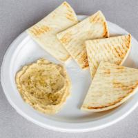 Hummus · Served with warm pita bread.