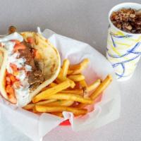 Gyro Pita · Shaved rotisserie lamb served on pita bread with tomatoes, onions and tzatziki sauce. Availa...