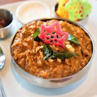 Agraharam Bisibelebath · Rice cooked with lentils, vegetables, nuts, spices, ghee.