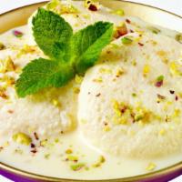 Aahaar Rasmalai (2 Pcs.) · Cheese balls simmered in sweetened condensed milk.