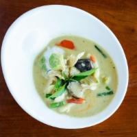 Avocado Green Curry · Fresh avocado in classic green curry, red bell pepper, and basil.