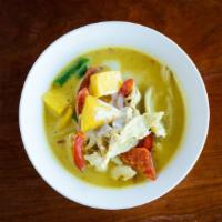 Mango Tango Curry · Fresh cut mango in a classic curry with red potato, green bean, red bell pepper and carrot.
