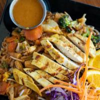 Lemongrass Chicken Pad Thai · A classic Pad Thai with broccoli, carrot, baby corn, and cabbage topped with lemongrass chic...