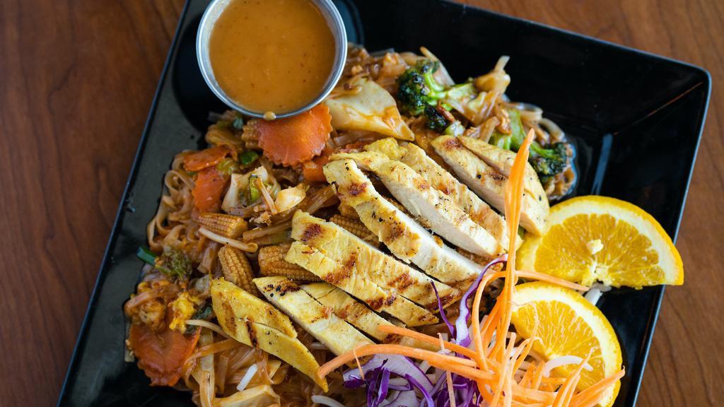 Lemongrass Chicken Pad Thai · A classic Pad Thai with broccoli, carrot, baby corn, and cabbage topped with lemongrass chicken.