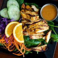 Lemongrass Chicken · Grilled lemongrass chicken comes with spinach, cucumber, and carrot, served with peanut sauce.