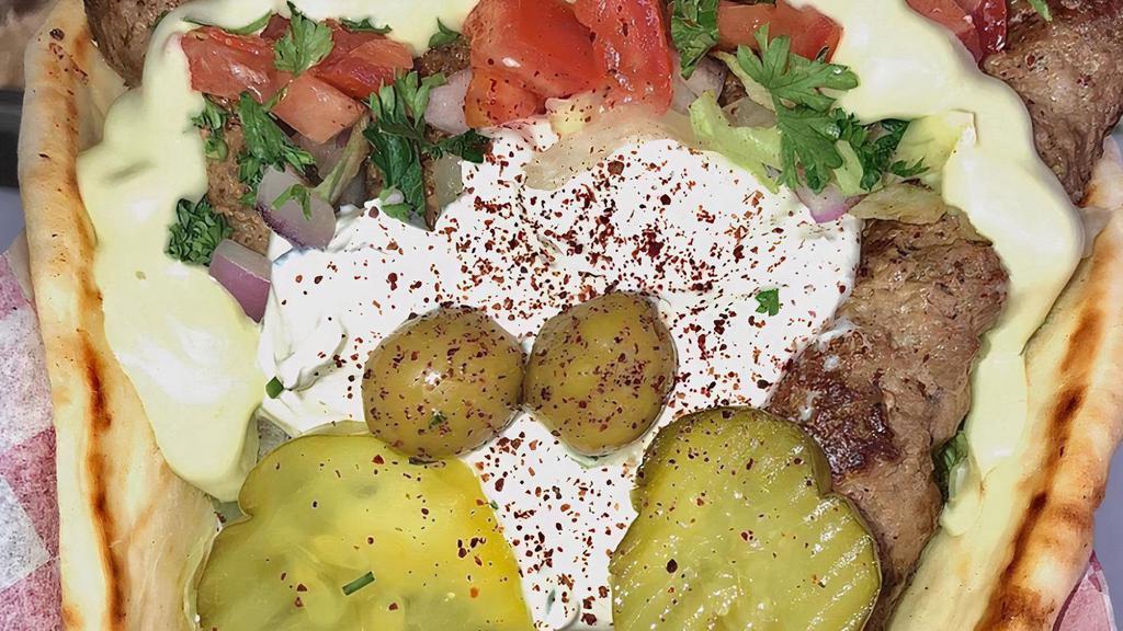 Kabab Gyro · Lettuce, tomatoes, pickle, olive, and tzatziki