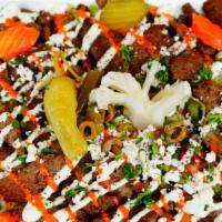 Gyro Salad · Lettuce, tomatoes, pickles, italian dressing, lamb, tzatziki, and feta cheese.