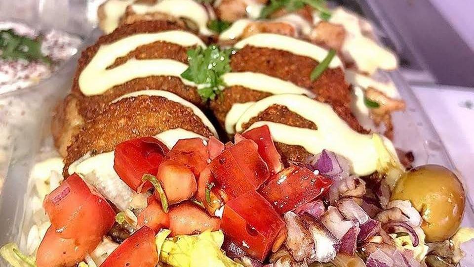 Falafel Plate · Falafel plate  rice, falafels, hummus, tzatziki, lettuce, tomatoes, pickles, and pita bread.
