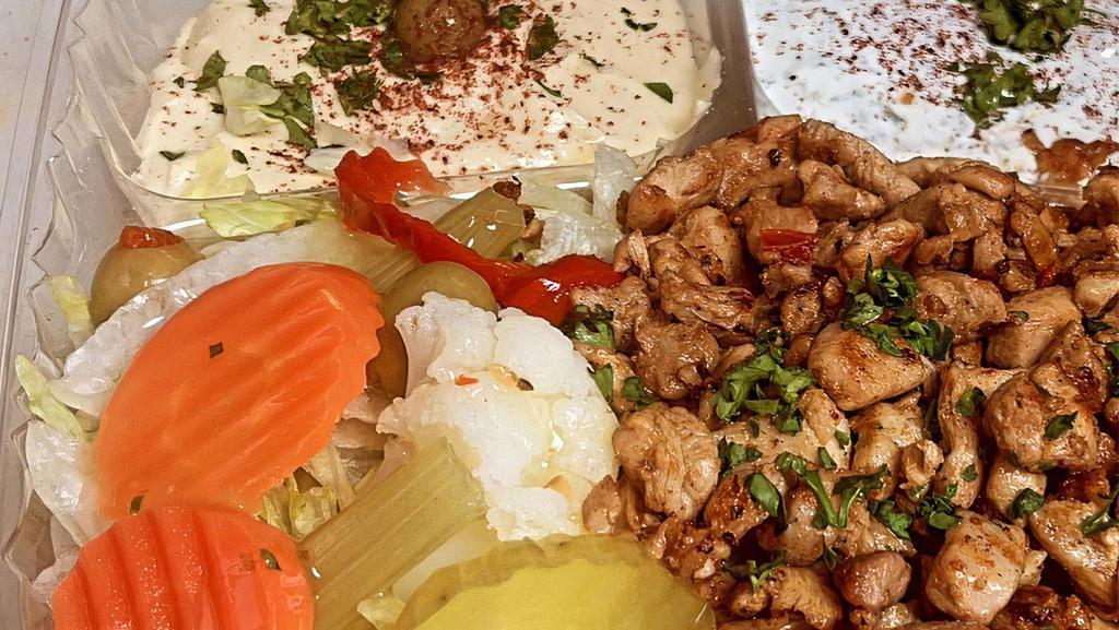 Chicken Plate · Rice, chicken, hummus, tzatziki, lettuce, tomatoes, pickles, and pita bread.