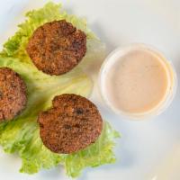 Falafel · Ground chickpea patties deep fried, served with tahini sauce.