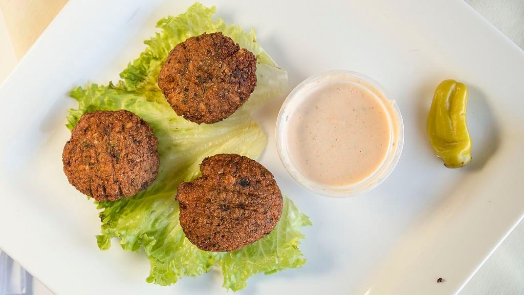 Falafel · Ground chickpea patties deep fried, served with tahini sauce.