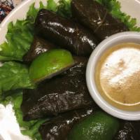Dolmas · Stuffed grape leaves with rice and herbs. Served chilled.