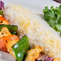 Shish Kebab · Marinated kebab with bell pepper, tomato, and onion broiled over an open fire, served with r...