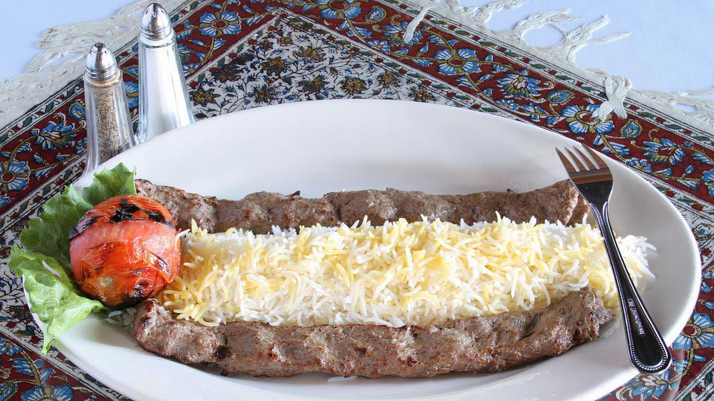 Chelo Kebab Koobideh · Marinated organic ground beef or chicken broiled over an open fire.