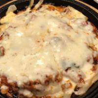 Cheese Buldak · Spicy chicken deep fried and topped, and  bottomed with cheese.