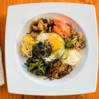 Bibimbop · Steamed rice with beef and assorted vegetables with Korean spicy sauce.