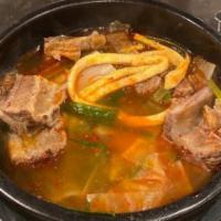 Galbi Tahng · Beef short ribs soup with sweet potato noodle (spicy available).