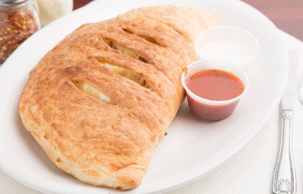 Build Your Own Calzone · Comes with ricotta and mozzarella cheese, choose up to four toppings.