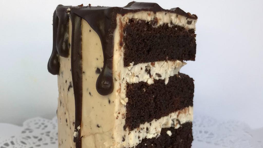 Vegan Stracciatella Cake Slice · Devil's Food cake layered with with a “stracciatella” chip buttercream - like chocolate chip, only better!
