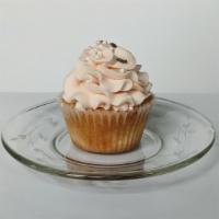 Pink Champagne Cupcake With Strawberry Filling · A pink champagne cupcake filled with strawberry preserves, and topped with pink champagne bu...