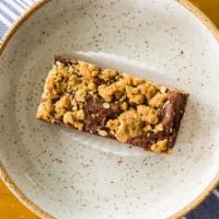 Fudgy Oat Bar · Chocolate fudge bar with walnuts and a chewy oat crust.