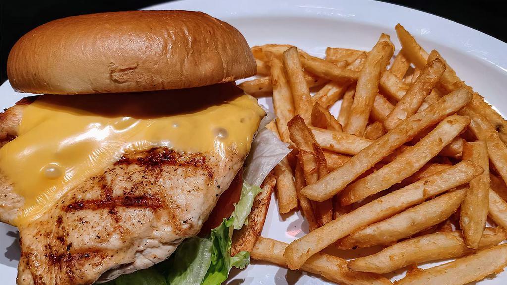 Grilled Chicken Sandwich Combo · Flame grilled skinless chicken breast with lettuce, tomato, mayonnaise and choice of cheese on a buttered brioche bun with your choice of fries
