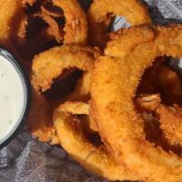 Basket Of Onion Rings · Basket of breaded and deep fried onion rings served with your choice of dipping sauce.